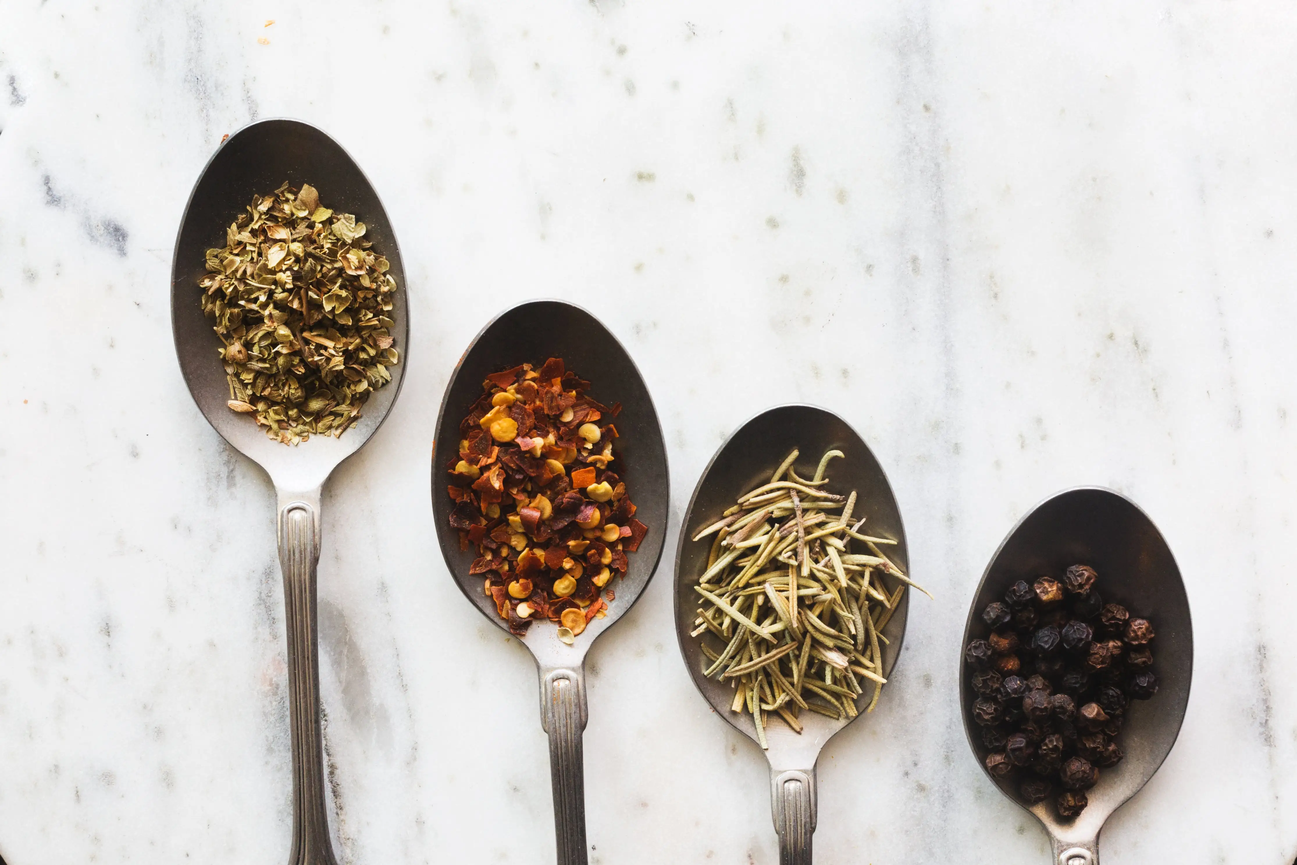 Colorful spices in spoons