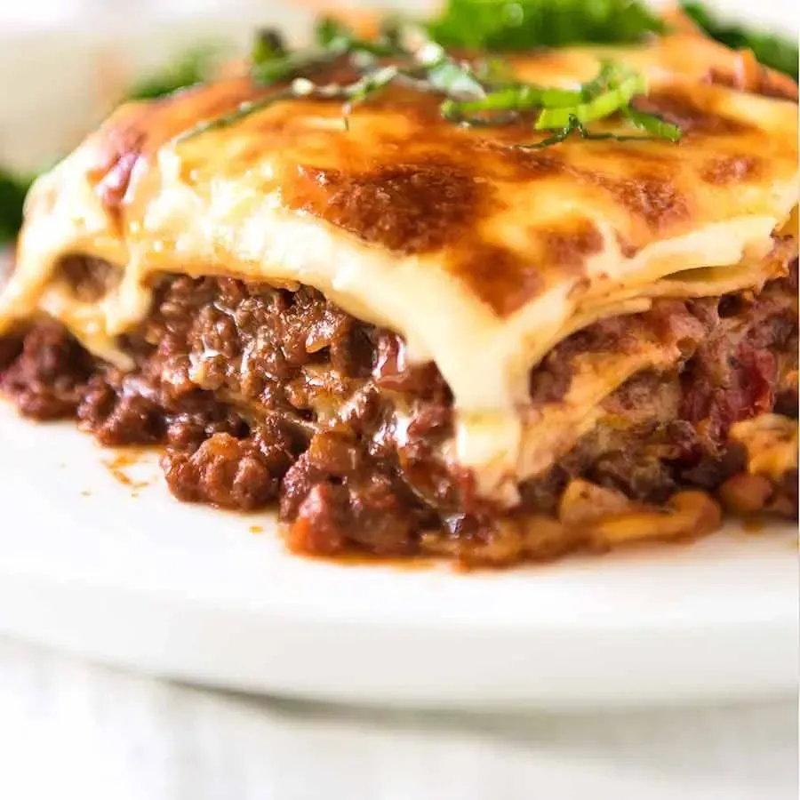 Homemade lasagna with layers of meat sauce, ricotta and melted cheese